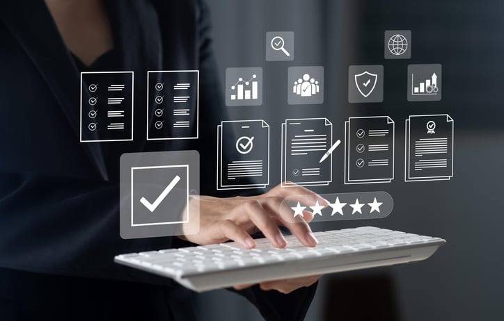 Fingers on keyboard and data on screen